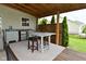 Backyard deck featuring an outdoor kitchen with a built-in sink, refrigerator, and seating with privacy fence at 5507 Wakefield Rd, Greenwood, IN 46142