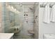Modern shower with glass door, mosaic tile accent wall, and dual shower heads at 5507 Wakefield Rd, Greenwood, IN 46142