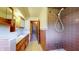 Functional bathroom featuring a shower and vanity with wooden cabinets at 5683 Steven Dr, Greenwood, IN 46142