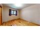 Neutral bedroom with hardwood flooring and a window providing natural light at 5683 Steven Dr, Greenwood, IN 46142