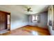 Bedroom with hardwood floors, ceiling fan, and a connecting door at 5683 Steven Dr, Greenwood, IN 46142