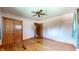 Bedroom with hardwood floors, ceiling fan, and a double closet at 5683 Steven Dr, Greenwood, IN 46142