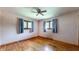 Bedroom featuring hardwood floors and multiple windows at 5683 Steven Dr, Greenwood, IN 46142