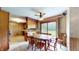 Bright dining area with patio access and an adjacent kitchen at 5683 Steven Dr, Greenwood, IN 46142