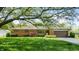 Charming brick home with an attached garage and well-manicured landscaping at 5683 Steven Dr, Greenwood, IN 46142