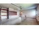 Clean, spacious garage with shelves, pegboard, and an automatic door opener at 5683 Steven Dr, Greenwood, IN 46142