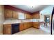 Functional kitchen with wood cabinets, and a black dishwasher at 5683 Steven Dr, Greenwood, IN 46142