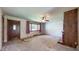 Inviting living room with a large window, a ceiling fan, and a wood panel accent wall at 5683 Steven Dr, Greenwood, IN 46142