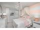Charming bedroom with pink accents, chandelier, and decorative canopy creates a cozy retreat at 5784 Summertree Pl, Whitestown, IN 46052