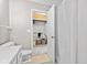 Bathroom view showcasing toilet, shower with white curtain and open door to a closet at 582 Conner Creek Dr, Fishers, IN 46038