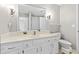 Bathroom featuring a single sink vanity with storage and a large mirror and a toilet with white wall color at 582 Conner Creek Dr, Fishers, IN 46038