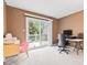 Cozy bedroom with access to balcony featuring natural light and a work space at 582 Conner Creek Dr, Fishers, IN 46038