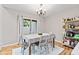 Bright dining area with sliding glass doors leading to an outdoor space and ample natural light at 582 Conner Creek Dr, Fishers, IN 46038
