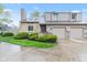 Charming townhome featuring a stone accent facade, attached garage, and well-maintained landscaping at 582 Conner Creek Dr, Fishers, IN 46038
