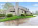 Attractive townhome with beige siding, stone details, and a private rear balcony and gated yard at 582 Conner Creek Dr, Fishers, IN 46038