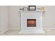 Close-up of the electric fireplace with white mantel and a marble-look tile hearth and surround at 582 Conner Creek Dr, Fishers, IN 46038