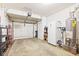 Spacious garage area featuring storage, a water heater, and an open garage door at 582 Conner Creek Dr, Fishers, IN 46038