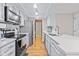Well-equipped kitchen with stainless steel appliances, sleek countertops, and ample cabinet space for storage at 582 Conner Creek Dr, Fishers, IN 46038