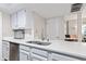 Contemporary kitchen with sleek countertops, stainless steel dishwasher, and a modern sink for convenience at 582 Conner Creek Dr, Fishers, IN 46038