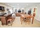 Spacious basement includes a bar, dining table, and comfortable seating area at 5851 Beisinger Pl, Indianapolis, IN 46237