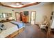 Bedroom featuring tray ceilings, a ceiling fan, natural light, and multiple entry points to other rooms at 5851 Beisinger Pl, Indianapolis, IN 46237