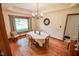 Dining room with hardwood floors, natural light and a view of the entryway at 5851 Beisinger Pl, Indianapolis, IN 46237