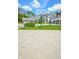 Long concrete driveway leads to homes with garages, plus a basketball hoop for recreational activities at 5851 Beisinger Pl, Indianapolis, IN 46237