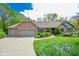 Charming brick home with a well-maintained lawn and beautiful landscaping at 5851 Beisinger Pl, Indianapolis, IN 46237