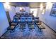 Finished home theater features tiered seating, plush reclining chairs, and movie posters for ambiance at 5851 Beisinger Pl, Indianapolis, IN 46237
