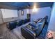 A finished home theater with reclining seating, projector, and screen for immersive entertainment at 5851 Beisinger Pl, Indianapolis, IN 46237