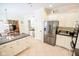 Spacious kitchen featuring modern stainless steel appliances, white cabinets and granite countertops at 5851 Beisinger Pl, Indianapolis, IN 46237