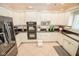 A large kitchen features white cabinets, stainless appliances, and granite countertops at 5851 Beisinger Pl, Indianapolis, IN 46237