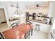 Bright kitchen features stainless appliances, black granite countertops, and island with bar stool seating at 5851 Beisinger Pl, Indianapolis, IN 46237