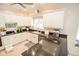 An open and airy kitchen area with white cabinets, granite countertops, and modern stainless appliances at 5851 Beisinger Pl, Indianapolis, IN 46237