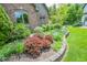 Beautiful landscaping with colorful plants surrounding the well maintained home at 5851 Beisinger Pl, Indianapolis, IN 46237
