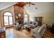 Cozy living room with a brick fireplace, a vaulted ceiling and natural lighting at 5851 Beisinger Pl, Indianapolis, IN 46237