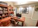Office space with a large wooden desk, hutch, and Purdue memorabilia at 5851 Beisinger Pl, Indianapolis, IN 46237