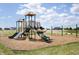 Vibrant community playground featuring multiple slides, swings, and climbing structures for children to enjoy at 588 Bluestem Ln, New Whiteland, IN 46184