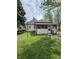 Cozy home featuring a screened-in porch and a lush backyard at 593 S 10Th S St, Noblesville, IN 46060
