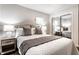 Bright bedroom with neutral tones, comfortable furniture, and mirrored closet doors at 6137 Evanston Ave, Indianapolis, IN 46220