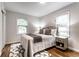 Inviting bedroom offers natural light, stylish rug, and comfortable furniture at 6137 Evanston Ave, Indianapolis, IN 46220