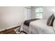 Cozy bedroom featuring a comfortable bed, modern decor, and ample natural light at 6137 Evanston Ave, Indianapolis, IN 46220