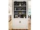 Built-in shelves feature stylish décor and storage, connecting the kitchen and dining areas at 6137 Evanston Ave, Indianapolis, IN 46220