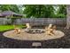 Cozy backyard firepit area with Adirondack chairs, perfect for outdoor relaxation and entertaining at 6137 Evanston Ave, Indianapolis, IN 46220