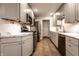 This modern kitchen features stainless steel appliances, marble counters, and ample cabinet space at 6137 Evanston Ave, Indianapolis, IN 46220