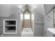 Full bath with tile shower and built-in shelves at 6159 Broadway St, Indianapolis, IN 46220