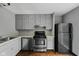 Efficient kitchen layout featuring modern appliances and neutral color scheme at 6159 Broadway St, Indianapolis, IN 46220