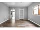 Cozy room featuring neutral walls and hardwood floors at 6159 Broadway St, Indianapolis, IN 46220