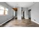 Spacious open floor plan room featuring wood floors and neutral paint at 6159 Broadway St, Indianapolis, IN 46220