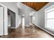 Bright living room with hardwood floors and a glimpse of open floorplan at 6159 Broadway St, Indianapolis, IN 46220